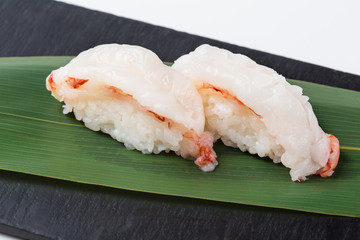 sushi nigiri on a black plate