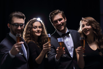 portrait of a group of friends celebrating their success