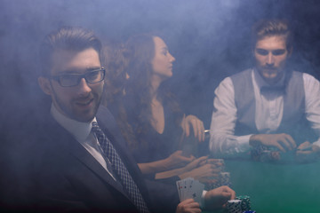 businessman showing four aces