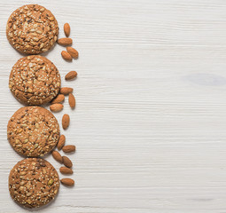 homemade cookies on white wooden background with nuts