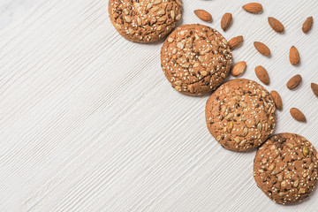 homemade cookies on white wooden background with nuts