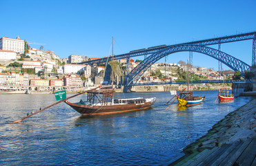 Fototapeta na wymiar PORTO, PORTUGAL - Dec 29, 2014: A popular touristic destination Porto, Portugal old town skyline from across the Douro River