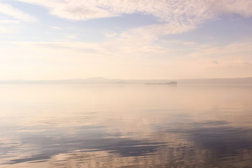 Fototapeta na wymiar sky reflection on the lake bolsena 