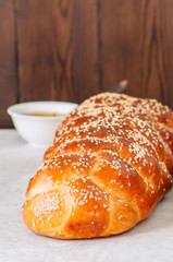 Traditional Challah Bread on a white stone background. Close up.