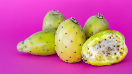 Prickly Pears on a pink background. Also known as a Cactus pear.