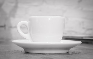 Obraz na płótnie Canvas Coffee cup on the table. (Black and white tone)
