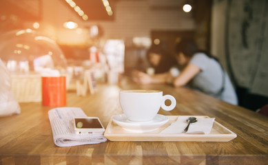 cup of coffee tablet and smart phone on wooden table