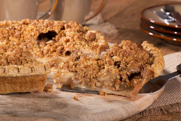 Closeup of serving a slice of Dutch apple pie