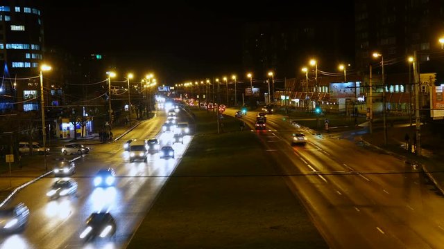 Night traffic in city. Timelapse. Night scenery of highway with transportation traffic in night downtown, time lapse. 4K UHD. Kaliningrad - December 2017 .