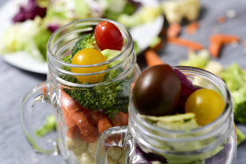 salad served in some mason jars