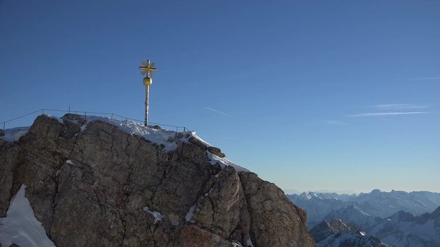The summit peak of Germany's tallest mountain, the Zugspitze early at morning on a bright winter's day.