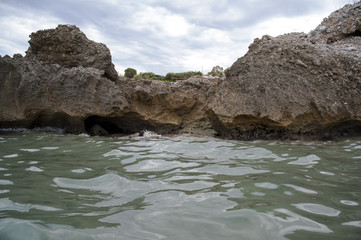 Tidal flow against the sea stack along the promenade 