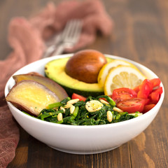 vegetables with lemon in white bowl