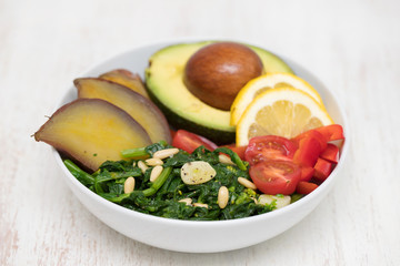 vegetables with lemon in white bowl