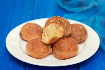 Brazilian snack cheese bread on white plate