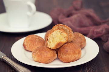 Brazilian snack cheese bread on white plate