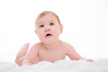Adorable little baby girl smiling on white background
