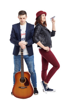 A musical duet is a guy with an acoustic guitar, and a girl with a paper airplane.
