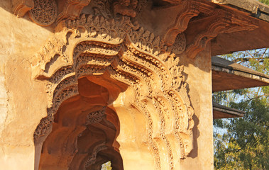Lotus Mahal Temple in Hampi, Karnataka, India. Beautiful carved stone arch and sunset. A popular...