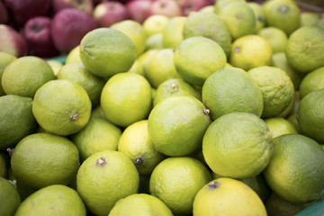 craft box with fresh limes. Lime harvest. many limes. lime close up.