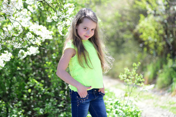 Girl with tricky face on nature background, defocused.