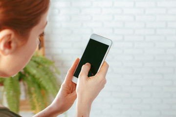 close up of woman texting on smartphone