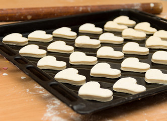 Obraz na płótnie Canvas Cookies ready for baking. Cookies in the shape of a hearts, ready for oven