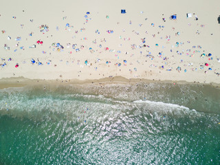 Fototapeta na wymiar Beach umbrellas top down aerial landscape views