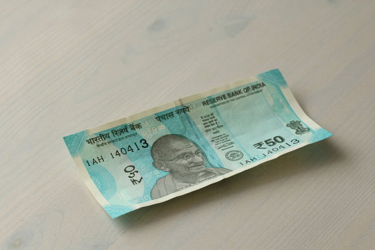 A new banknote of India with a denomination of 50 rupees. Indian currency. Portrait of Mahatma Gandhi