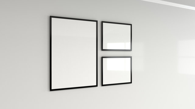 Blank white poster in black frame on the wall