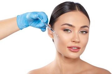 Portrait of an attractive young woman receiving botox treatment.