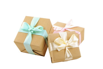 Rustic composition w/ bunch of beautiful presents in craft paper wrapping. Close up of many gifts in brown wrap with ribbon and bow.