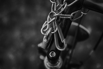 Padlock bicycle lock Close-up lock with security chain attached.