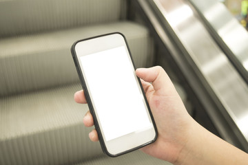 Young men use cell phones to pay for their purchases instead of paying with bills.