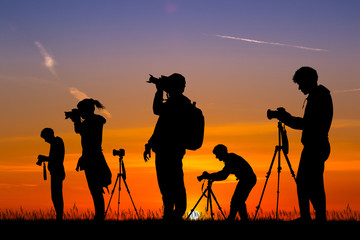 illustration of photographers at sunset - obrazy, fototapety, plakaty