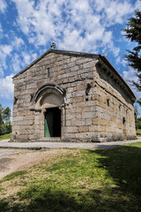 Fototapeta na wymiar Romanesque Church of the Archangel Michael (Igreja de Sao Miguel do Castelo, 1216) in Castle of Guimaraes - medieval castle in the municipality Guimaraes, in the northern region of Portugal.