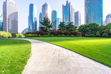 Fototapeta premium green lawn with modern building in park