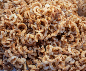 Closed up crispy pork rinds, deep fried pork skin appetizer or  snack base for background