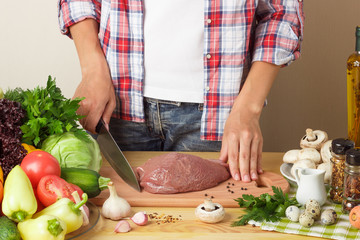 Woman cooks at the kitchen