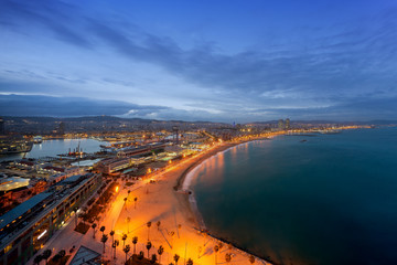 Fototapeta premium Aerial view of Barcelona Beach in summer night along seaside in Barcelona, Spain. Mediterranean Sea in Spain.
