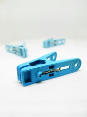 Blue Cloth clamp clothes peg isolated on white background with clipping path