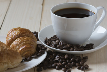 A cup of coffee and breakfast meal