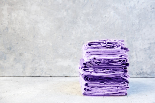 Stack of purple folded napkins