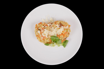 Risotto with carrot and cheese on black