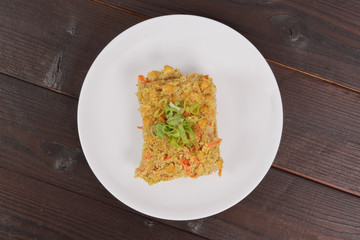 Polenta with poppy and vegetables on a table