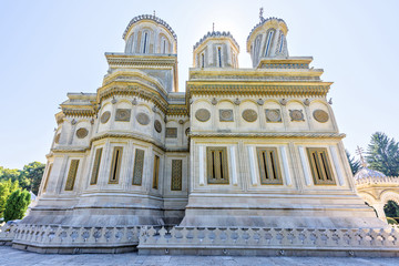 Daylight closeup view to monastery facade and domes