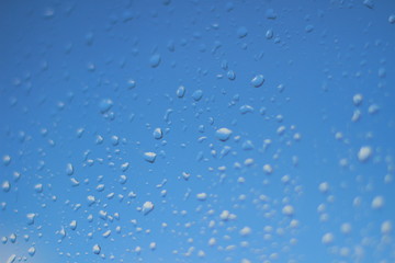Raindrops on glass close up.