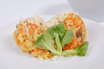 Risotto with carrot and cheese on white