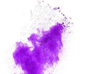 Powder explosion. Closeup of a purple dust particle explosion isolated on white. Abstract...