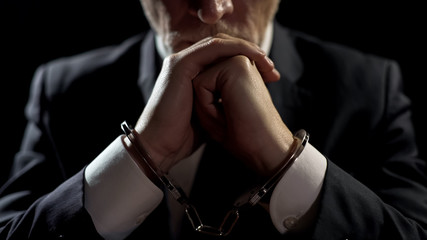 Punished oligarch handcuffed in prison, corrupt official accused of bribery